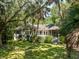 Charming exterior view of the home, showcasing architectural details and a well-maintained landscaped yard at 2938 Old Drake Dr, Seabrook Island, SC 29455