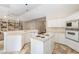 Spacious kitchen with white cabinets, an island, and an open layout to other living spaces at 2938 Old Drake Dr, Seabrook Island, SC 29455