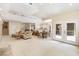Expansive living area with dining space, fireplace, and access to outdoor screened area at 2938 Old Drake Dr, Seabrook Island, SC 29455