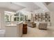 Open-concept living room with fireplace, adjoined to kitchen, offering views to backyard at 2938 Old Drake Dr, Seabrook Island, SC 29455