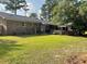 Spacious backyard featuring a patio, brick accents, and a well-maintained lawn at 306 Park St, Saint George, SC 29477