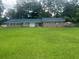 Traditional brick single-story home with a large green front lawn at 306 Park St, Saint George, SC 29477
