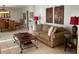 Comfortable living room with tile flooring, couch, coffee table, and dining area in view at 306 Park St, Saint George, SC 29477