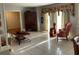 Bright living room featuring tiled floors, neutral walls, and stylish decor at 306 Park St, Saint George, SC 29477