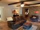 Inviting living room with leather sofa, hardwood floors, and brick accents at 306 Park St, Saint George, SC 29477