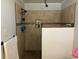 The remodeled shower is beautifully tiled and features dual shower heads, a built-in niche, and a white paneled half-wall at 306 Park St, Saint George, SC 29477