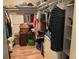 This walk-in closet features plenty of storage for your clothes and accessories, including shelves, rods, drawers, and a mirror at 306 Park St, Saint George, SC 29477