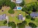 Expansive aerial view showcasing a well-maintained yard with a sparkling pool at 309 Pinopolis Park Dr, Moncks Corner, SC 29461