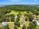 Picturesque aerial shot of a serene neighborhood surrounded by trees and the tranquil waters of the bay, offering privacy at 309 Pinopolis Park Dr, Moncks Corner, SC 29461