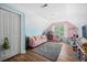 Spacious bedroom with sloped ceilings, plush carpet, and a cozy reading nook at 309 Pinopolis Park Dr, Moncks Corner, SC 29461