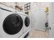 Convenient laundry room featuring front load washer and dryer at 309 Pinopolis Park Dr, Moncks Corner, SC 29461