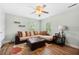 Relaxing living room with sectional sofa, ceiling fan, and cozy accents at 309 Pinopolis Park Dr, Moncks Corner, SC 29461