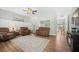 Cozy living room with hardwood floors, wainscoting, and comfortable seating at 309 Pinopolis Park Dr, Moncks Corner, SC 29461