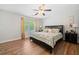 Main bedroom with wooden floors, natural light, and ceiling fan at 309 Pinopolis Park Dr, Moncks Corner, SC 29461