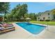 Inviting backyard pool featuring lounge chairs and ample space for recreation at 309 Pinopolis Park Dr, Moncks Corner, SC 29461