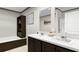 Well-appointed bathroom with dual sinks, a large mirror, and a separate bathtub and shower area at 313 Marion Rd, Dorchester, SC 29437