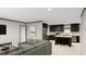 Open-concept living area with a comfortable sofa flowing into a modern kitchen with a center island at 313 Marion Rd, Dorchester, SC 29437