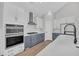 Spacious kitchen with a waterfall island, modern appliances, and ample counter space at 3170 Vanessa Lynne Ln, Johns Island, SC 29455