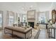 Bright living room featuring a fireplace, modern furniture, and lots of natural light at 3170 Vanessa Lynne Ln, Johns Island, SC 29455