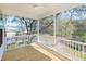 Screened porch with wood floors, offering outdoor living space and scenic views at 3170 Vanessa Lynne Ln, Johns Island, SC 29455