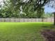Wide view of the grassy, fenced backyard at 352 Oxford Rd, Ladson, SC 29456