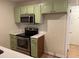 This kitchen features stainless steel appliances, a microwave, and quartz countertops at 352 Oxford Rd, Ladson, SC 29456