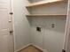 Pantry area features wooden shelves, a door and a light at 352 Oxford Rd, Ladson, SC 29456