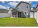 Backyard with a fenced yard and screened-in porch, perfect for outdoor relaxation and entertaining guests at 3903 Poplar Grove Pl, Summerville, SC 29483