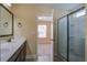 Bathroom featuring white vanity, tile floor and glass shower enclosure at 3903 Poplar Grove Pl, Summerville, SC 29483