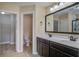 Bathroom featuring double sink vanity, large mirror, and tile floors at 3903 Poplar Grove Pl, Summerville, SC 29483