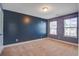 Bedroom with unique wall art, features two windows for plenty of natural light at 3903 Poplar Grove Pl, Summerville, SC 29483