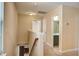 Bright upstairs hallway featuring carpet floors and access to multiple rooms at 3903 Poplar Grove Pl, Summerville, SC 29483
