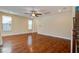 Bright living room featuring wood floors and a ceiling fan at 3903 Poplar Grove Pl, Summerville, SC 29483