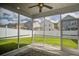 Screened-in porch with view of fenced backyard and neighboring homes providing an ideal outdoor retreat at 3903 Poplar Grove Pl, Summerville, SC 29483