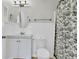 Well-lit bathroom features white vanity and a black and white shower curtain at 4030 Babbitt St, Charleston, SC 29414