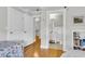 Bright bedroom boasts bamboo floors, fresh white trim, and an ensuite bathroom at 4030 Babbitt St, Charleston, SC 29414