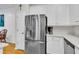 Spacious kitchen with stainless steel refrigerator, white cabinetry, and modern countertops for a clean, updated look at 4030 Babbitt St, Charleston, SC 29414