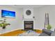 Charming living room featuring a cozy fireplace, hardwood floors, and contemporary decor for a comfortable space at 4030 Babbitt St, Charleston, SC 29414