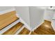 Staircase features painted risers and stained treads with light hardwood flooring at 4030 Babbitt St, Charleston, SC 29414