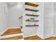 Staircase features floating wooden shelves with decorative items and light hardwood flooring at 4030 Babbitt St, Charleston, SC 29414