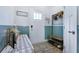 Bright foyer showcasing wood-look flooring, stylish decor, and wainscoting at 412 Grand Palm Ln, Summerville, SC 29485