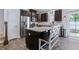 Modern kitchen with granite countertops, stainless steel appliances, and dark wood cabinetry at 412 Grand Palm Ln, Summerville, SC 29485