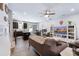 Open concept living room featuring neutral tones, hardwood floors, and kitchen view at 412 Grand Palm Ln, Summerville, SC 29485