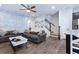 Inviting living room with modern decor, ceiling fan, and hardwood floors with a staircase to the upper level at 412 Grand Palm Ln, Summerville, SC 29485