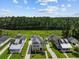 Aerial view of neighborhood with lush landscaping and mature trees at 4140 Home Town Ln, Ravenel, SC 29470