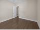 Spacious bedroom with neutral walls, wood-look flooring, and trim work at 4140 Home Town Ln, Ravenel, SC 29470