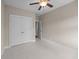 A neutral bedroom featuring white floors and a closet at 4140 Home Town Ln, Ravenel, SC 29470