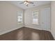 Bedroom with a ceiling fan, two windows and wood-look flooring at 4140 Home Town Ln, Ravenel, SC 29470
