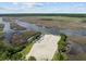 Aerial view of a boat ramp and parking lot offering access to the river at 4140 Home Town Ln, Ravenel, SC 29470