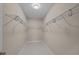 A walk-in closet with white shelving and tile floors at 4140 Home Town Ln, Ravenel, SC 29470